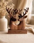Walnut twin deer heads sculpture on linen with baby's breath