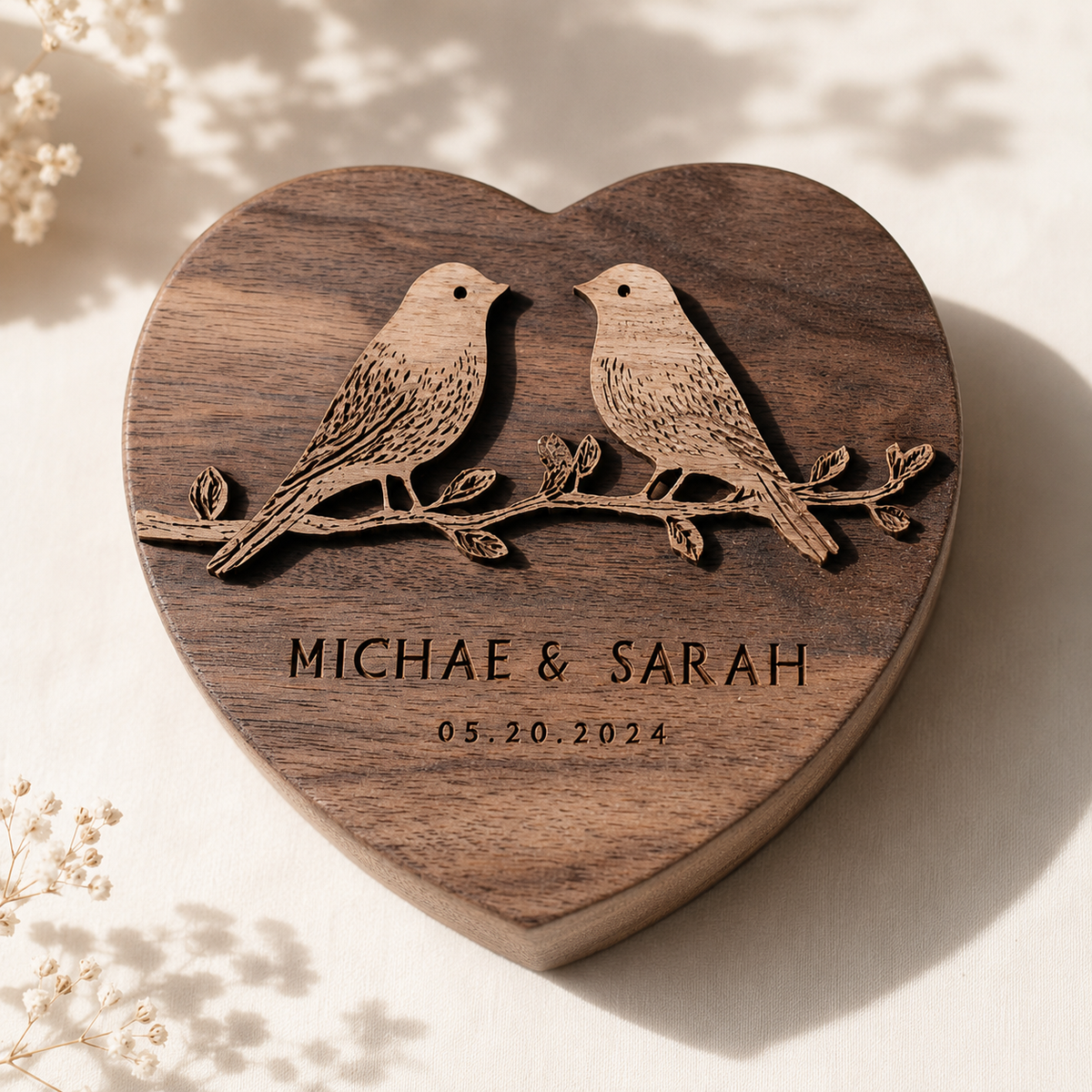Walnut heart-shape lovebirds keepsake top-down close-up