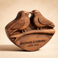 Walnut lovebirds sculpture with baby's breath and cream fabric